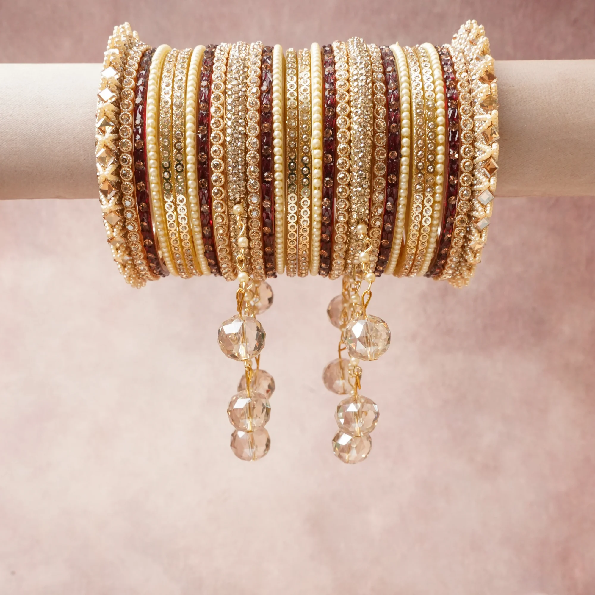 A commanding Maroon anchors this beautiful set, enriched with accents of Clear, Champagne Gold that add depth and dimension.

Featuring a striking composition of Gold-toned Metal, Imitation Pearls, Crystal, Mirror Inserts, this set carries intricate craftsmanship and strong presence. Grand in form, it is created for moments that deserve to be marked.